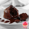 A rich chocolate lava cake with a gooey molten center, served on a white plate with chocolate drizzle.