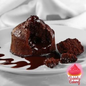 A rich chocolate lava cake with a gooey molten center, served on a white plate with chocolate drizzle.